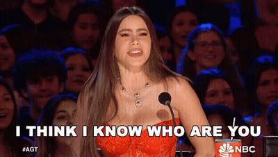 Woman Speaking Into Microphone Saying I Think I Know Who Are You GIF