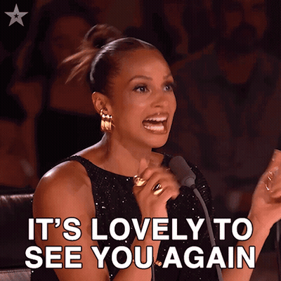 Woman Speaking Into Microphone Saying It's Lovely To See You Again GIF