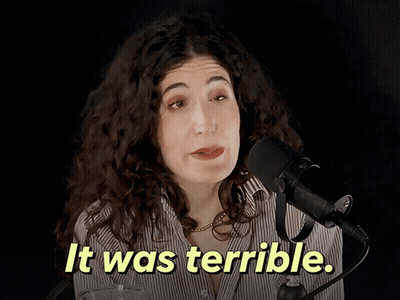 Woman Speaking Into Microphone Saying It Was Terrible GIF