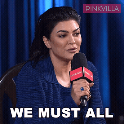 Woman Speaking Into Microphone Saying We Must All GIF