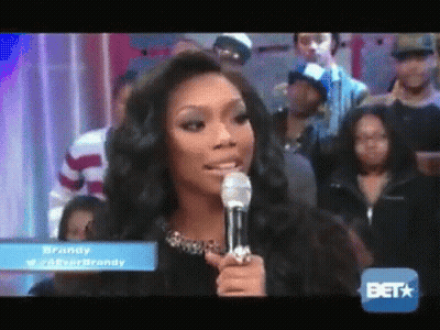 Woman Speaking Into Microphone With BET Logo GIF