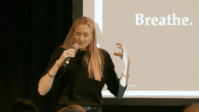 Woman Speaking Into Microphone With Breathe GIF