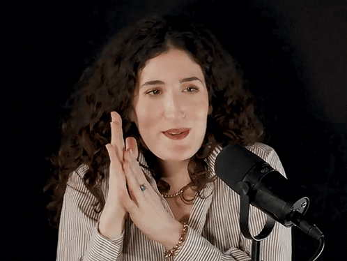Woman Speaking Into Rode Microphone GIF