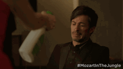 Woman Spray Bottle Shaking Man GIF