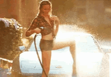 Woman Spray Water To Wet Tshirt GIF