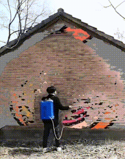 Woman Spraying Paint On Brick Wall With Blue Backpack GIF