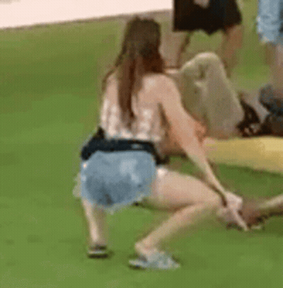 Woman Squatting Next To Man On Raft GIF
