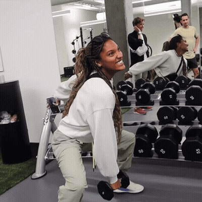 Woman Squatting With 50 Dumbbell GIF