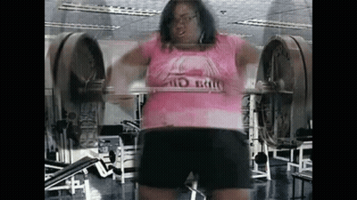 Woman Squatting With Barbell In Gym GIF