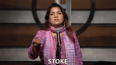 Woman Standing at Microphone Saying Stoke