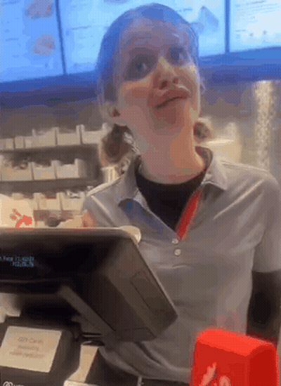 Woman Standing At Restaurant Cash Register GIF