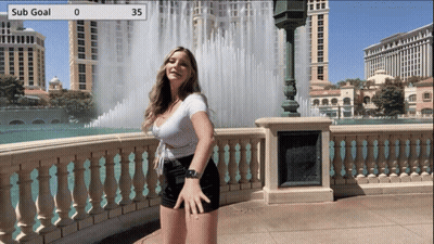 Woman Standing At Water Fountain With Sub Goal 35 GIF