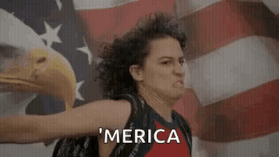 Woman Standing Before American Flag With Bald Eagle GIF