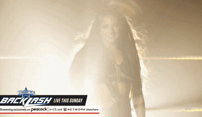Woman Standing Before Backlash Sign GIF