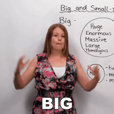 Woman Standing Before Big And Small GIF