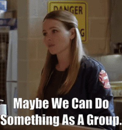 Woman Standing Before Danger Sign GIF