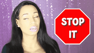 Woman Standing Before Stop Sign GIF