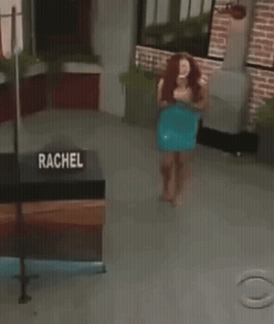 Woman Standing By Rachel Sign GIF