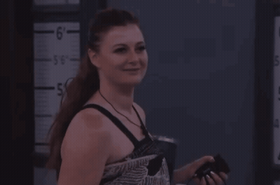 Woman Standing By Ruler Saying 6 GIF