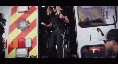 Woman Standing In Ambulance Doorway GIF