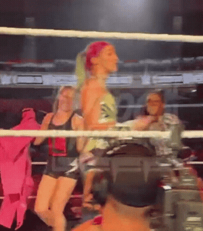 Woman Standing In Boxing Ring With Camera GIF
