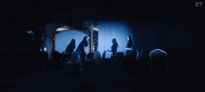 Woman Standing In Dark Room GIF
