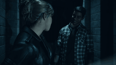 Woman Standing In Dark Room Looking Out Doorway GIF