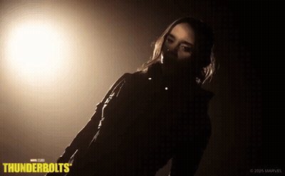 Woman Standing In Dark Room With Thunderbolts GIF
