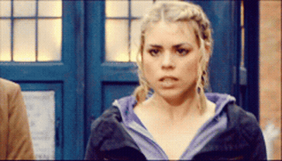 Woman Standing In Front Of Blue Door Serious GIF