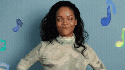 Woman Standing In Front Of Blue Wall With Music Notes GIF
