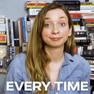 Woman Standing in Front of Bookshelf Saying Every Time