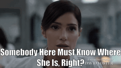 Woman Standing In Front Of Bookshelf With Ad GIF