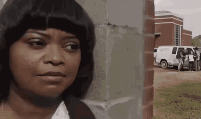 Woman Standing In Front Of Brick Wall GIF