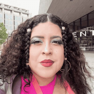 Woman Standing In Front Of Building Saying Ent GIF