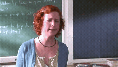 Woman Standing In Front Of Chalkboard GIF