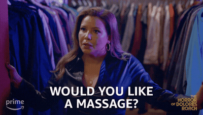 Woman Standing In Front Of Closet Would You Like A Massage GIF