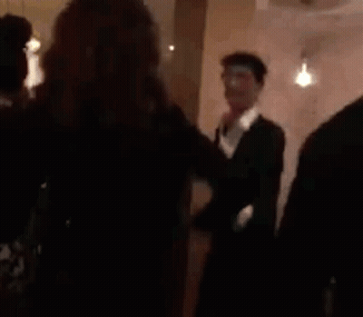 Woman Standing In Front Of Crowd In Restaurant GIF