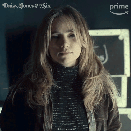 Woman Standing in Front of Daisy Jones and the Six