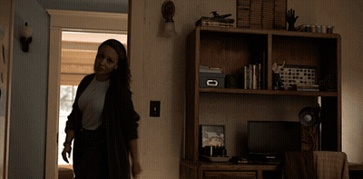 Woman Standing In Front Of Desk With Box GIF