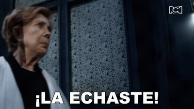Woman Standing In Front Of Door Saying La Echaste GIF