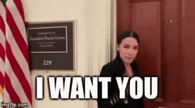 Woman Standing In Front Of Door With Sign Saying I Want You GIF