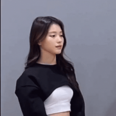 Woman Standing In Front Of Explosion Holding Flag GIF