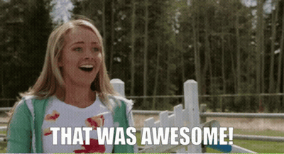 Woman Standing In Front Of Fence Saying That Was Awesome GIF