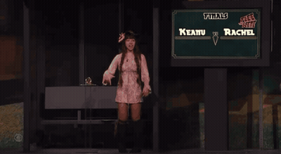 Woman Standing In Front Of Finals Sign GIF