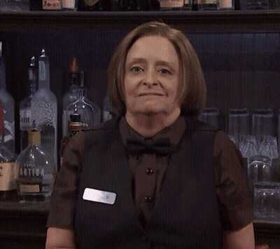 Woman Standing In Front Of Green Door GIF