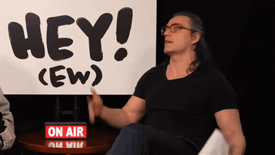 Woman Standing In Front Of Hey Crew Sign GIF