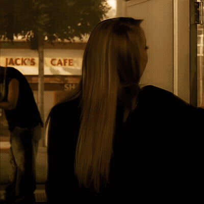 Woman Standing In Front Of Jack's Cafe GIF