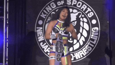 Woman Standing In Front Of King Of Sports Sign GIF