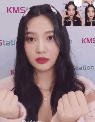 Woman Standing In Front Of KMS Station GIF