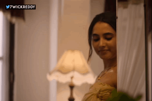 Woman Standing In Front Of Mirror GIF